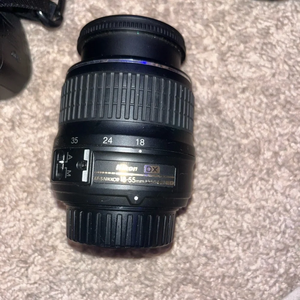 Nikon D3200 Camera. Includes Battery, 3 Nikon Lenses, Battery Charger, and Case.